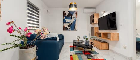 Basic Apartment, Patio, Courtyard View | Living area | 100-cm LCD TV with cable channels
