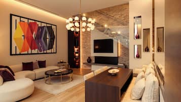 A modern living room with a sofa, coffee table, and a TV mounted on a brick wall.
