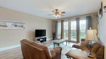 Signature Condo, 3 Bedrooms, Balcony, Lake View | Living room | 32-inch Smart TV with cable channels