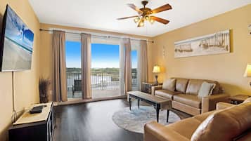 Signature Condo, 3 Bedrooms, Balcony, Lake View | Living room | 32-inch Smart TV with cable channels