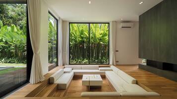 Family Villa, Garden View | Living area | 85-inch LED TV with digital channels