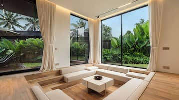 Family Villa, Garden View | Living area | 85-inch LED TV with digital channels