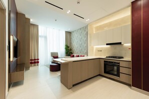 Deluxe Apartment, Balcony | Private kitchen - Binghatti Royale - Chic 1BR Retreat (Dubai)