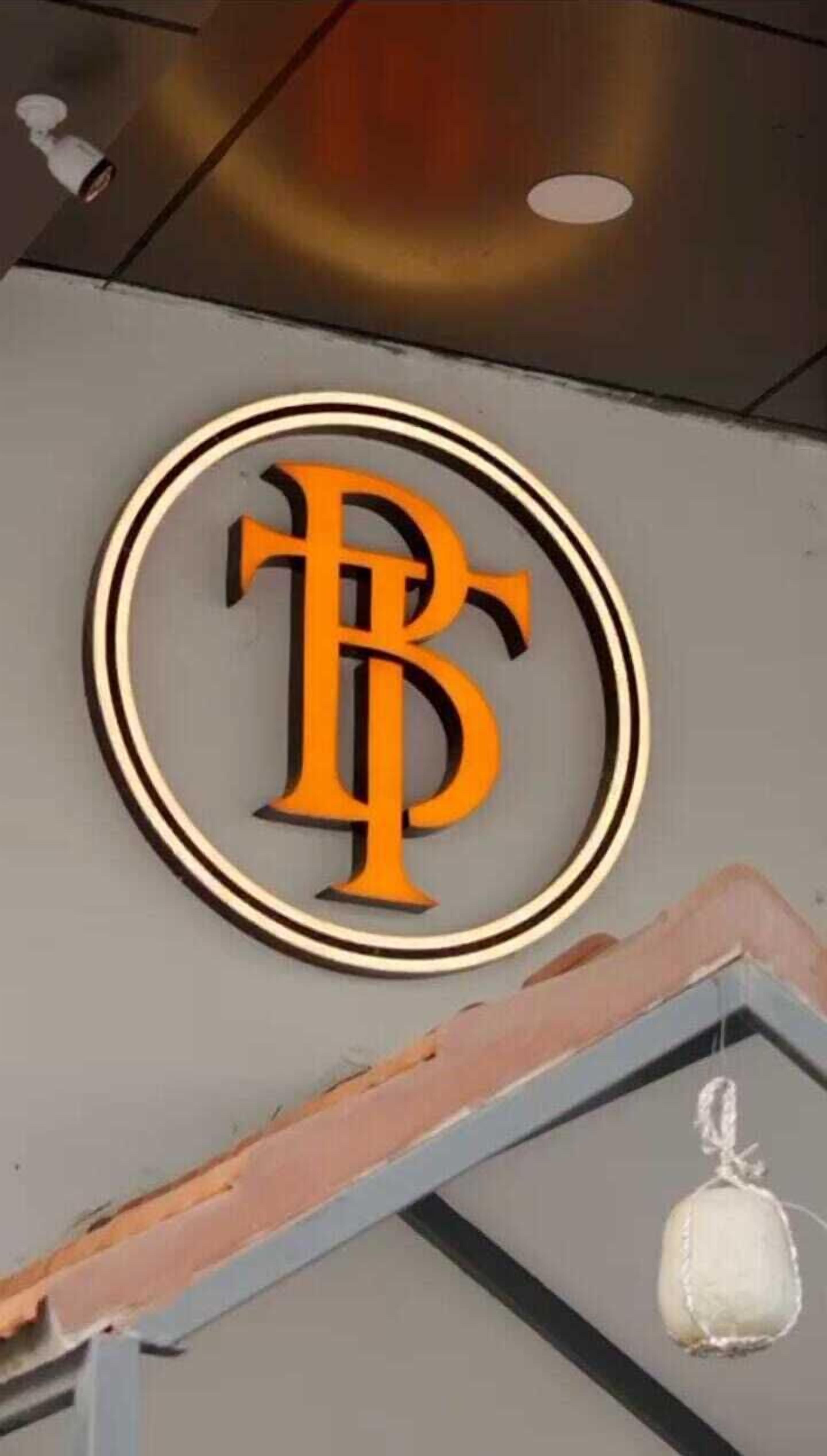 A logo with a stylized 'B' in orange and black on a grey background.