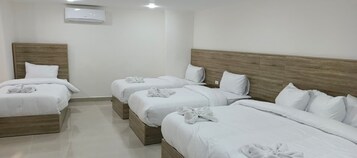 Quadruple Room, City View | Minibar, desk, free WiFi, bed sheets