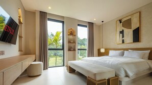 A modern hotel room with a large bed, a bench, a TV, and a view of the outdoors. - Quiet Luxury Villa Uluwatu. Private Pool, Workspace, Airport Pick Up & Butler (Bali)
