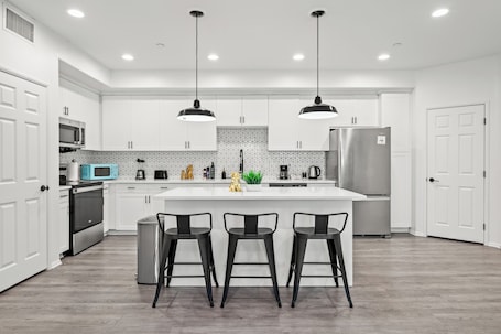 Fridge, microwave, oven, stovetop. Newly Remodeled 3BR Apt + Mins to Disney & Arcade