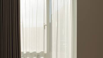 In-room safe, desk, laptop workspace, blackout curtains