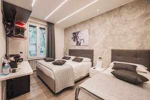 Comfort Triple Room, City View | Free minibar, in-room safe, desk, laptop workspace