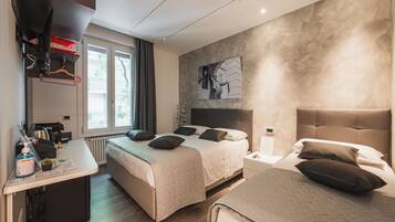 Comfort Triple Room, City View | In-room safe, blackout drapes, soundproofing, free WiFi