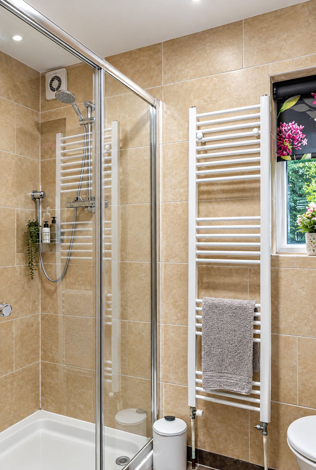 Walk in shower and heated towel rail