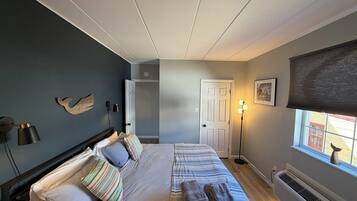 1 bedroom, desk, iron/ironing board, travel crib
