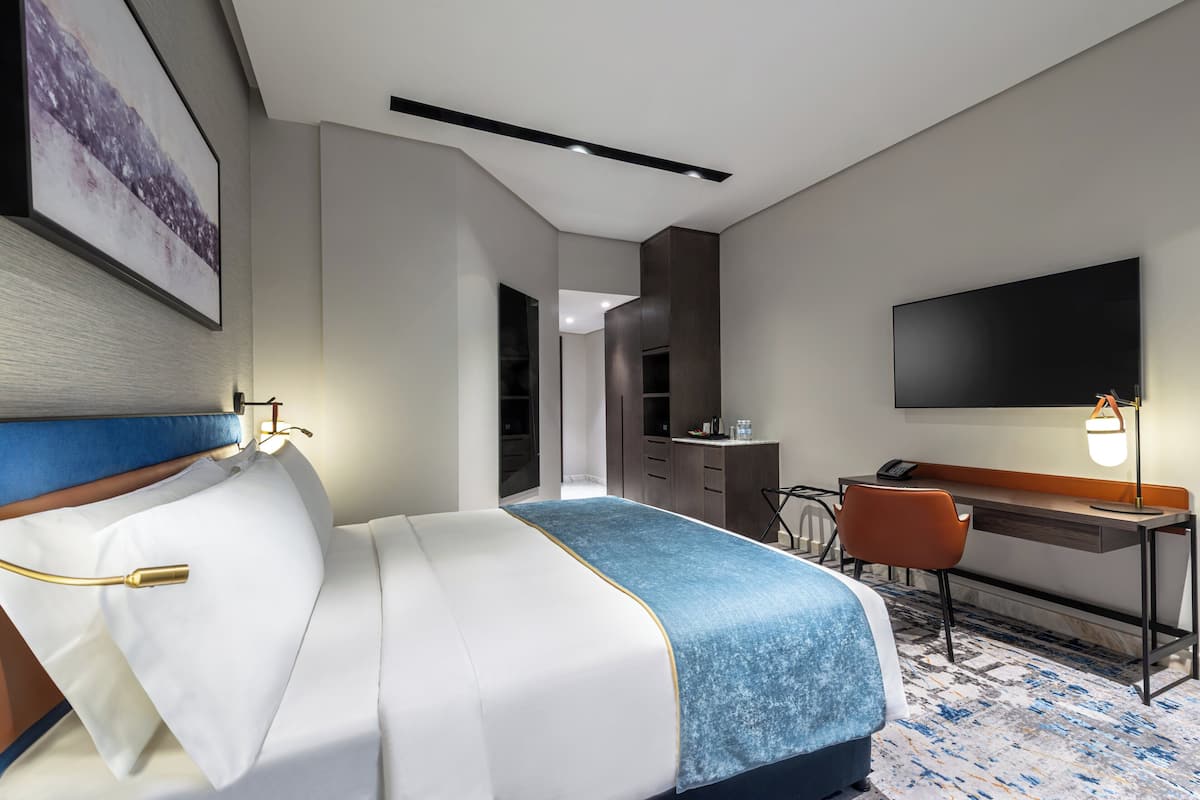 Premium bedding, down duvets, memory-foam beds, in-room safe