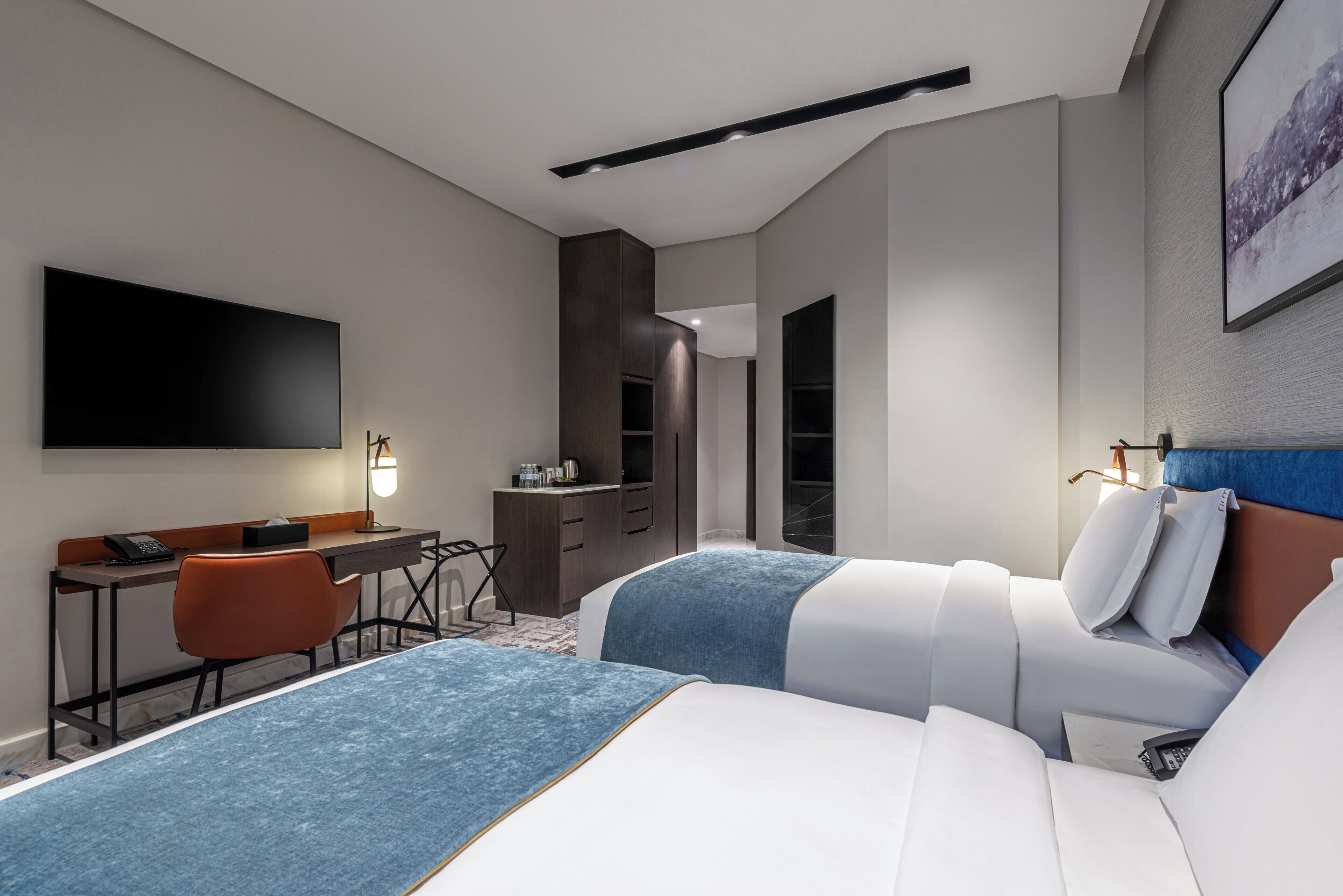 Premium bedding, down comforters, memory foam beds, in-room safe