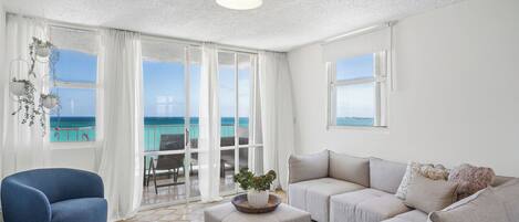 Apartment, Balcony, Sea View | Living area | 32-inch LED TV with digital channels