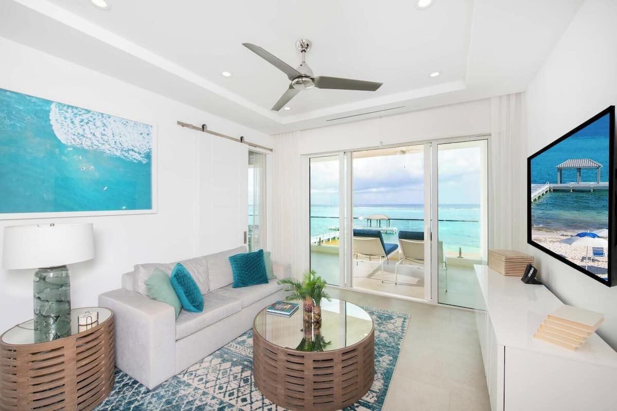 Luxury Condo, 2 Bedrooms, Balcony, Beachfront (Rum Point Resort #207) | Living area | Video-game console