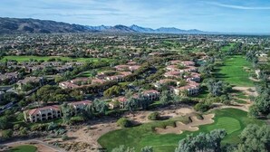 A residential area with houses arranged in rows, surrounded by greenery and a golf course. - Wyndham 1-Bedroom Studio in a Premier Resort with Full Amenities (Phoenix)