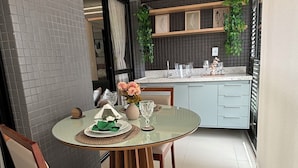 A modern kitchen with a dining area.