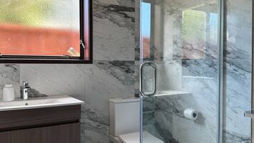 Shower, hair dryer, towels, soap