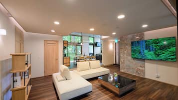 Comfort Villa, Balcony, Garden View | Living area | 75-inch Smart TV with digital channels