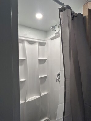 Shower, eco-friendly toiletries, hair dryer, towels