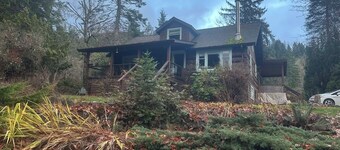 Charming Log Home on acreage bordering golf course