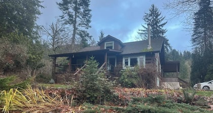 Charming Log Home on acreage bordering golf course