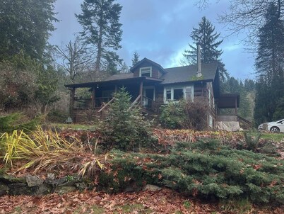 Charming Log Home on acreage bordering golf course