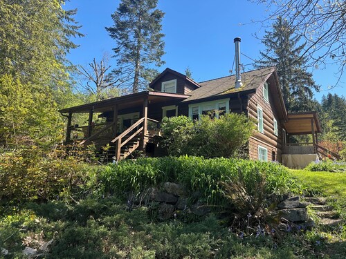 Charming Log Home on acreage bordering golf course with full gym