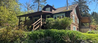Charming Log Home on acreage bordering golf course with full gym