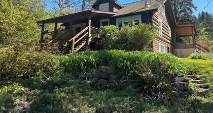 Charming Log Home on acreage bordering golf course with full gym
