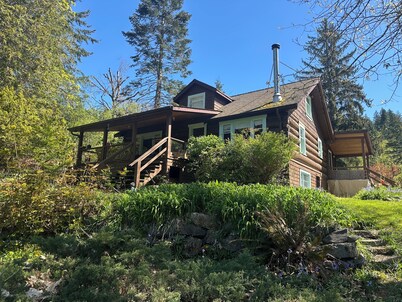 Charming Log Home on acreage bordering golf course with full gym
