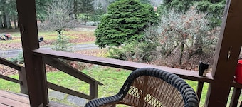 Charming Log Home on acreage bordering golf course with full gym
