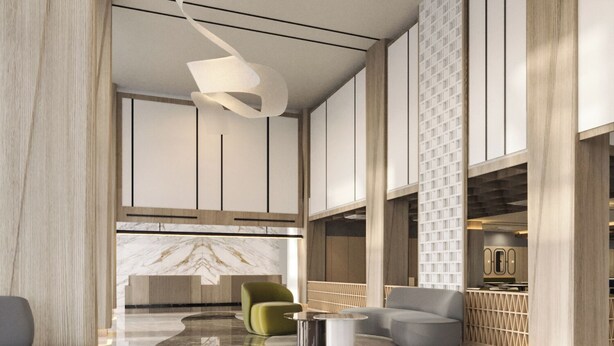 A modern lobby with a marble reception desk, seating area, and a high ceiling with a unique light fixture. - MAXONE Batam (Batam)