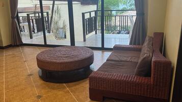 Apartment, 2 Bedrooms, Kitchenette, Sea View | Living area | 32-inch flat-screen TV with digital channels, Netflix