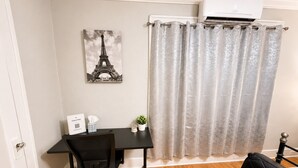 A room with a desk, chair, and a bed. - Paris-Inspired Downtown Studio - Toyota Center (Houston)
