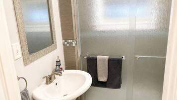 Shower, hair dryer, towels, soap