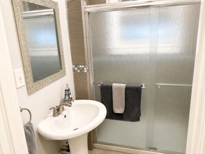 Shower, hair dryer, towels, soap