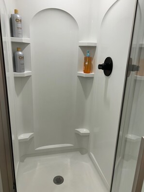 Shower, hair dryer, towels, soap