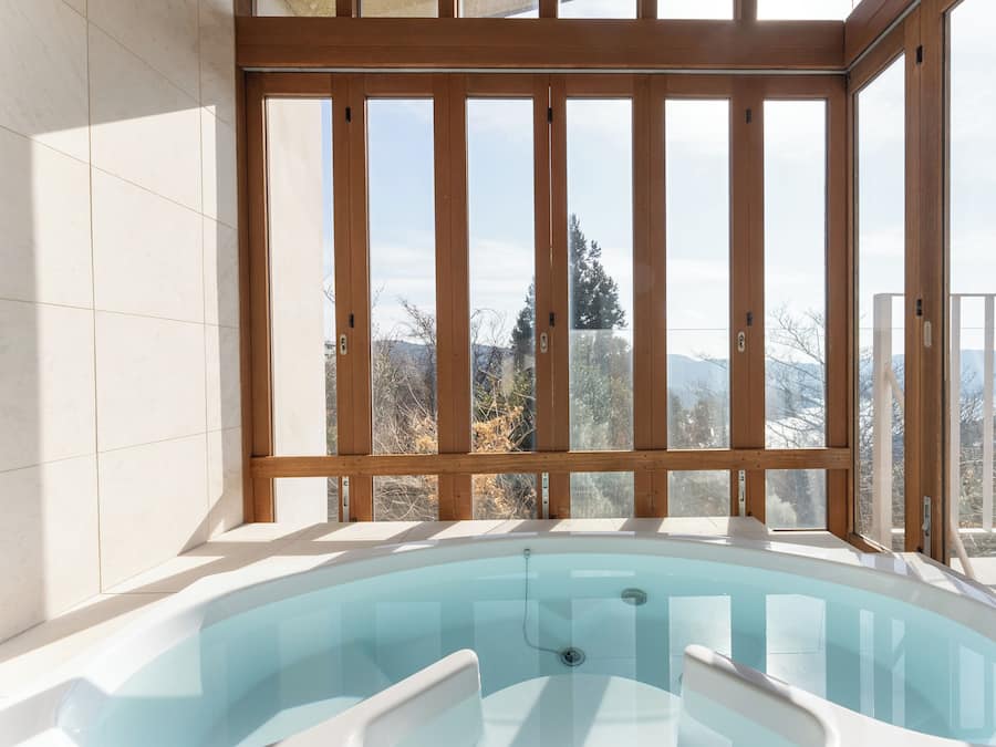 Panoramic Villa, Balcony, Lake View | Bathroom | Deep soaking tub, eco-friendly toiletries, hair dryer, slippers