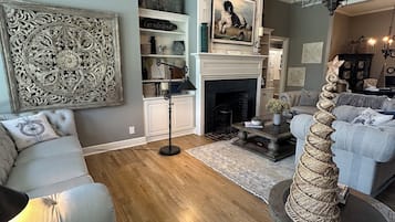 Smart TV, fireplace, books, printers