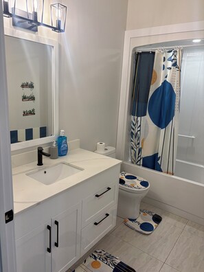 Hair dryer, towels, soap, shampoo