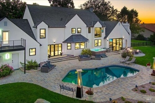 Luxurious 5-bedroom house in serene Eagle with sauna, pool, and fitness room.