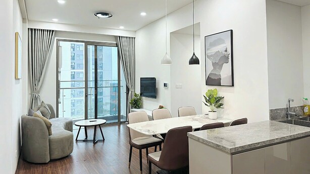 A modern apartment with a dining area, a kitchen, and a living room. - Vinhomes Ocean Park 1 Gia Lâm Apartment (Hanoi)