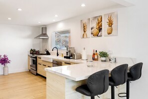 Fridge, stovetop, dishwasher, coffee/tea maker - LA Hillside Home with Canyon Views, Deck, BBQ & Game Room Fun | Marmol Vista (Los Angeles)