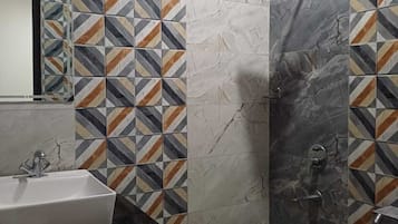 Separate tub and shower, towels, soap, toilet paper