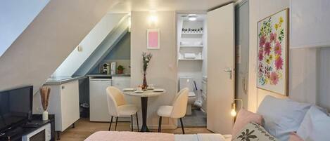 Desk, iron/ironing board, bed sheets