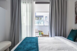 Suite monolocale Comfort | Area soggiorno | Smart TV 55 pollici con canali digitali