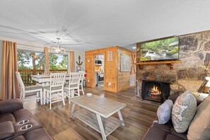 Superior House, 4 Bedrooms, Garden View, Lakeside | Living area | 55-inch Smart TV with digital channels, fireplace - Captain John's Cabin (Pigeon Forge)