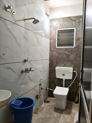 Deluxe Apartment, 2 Bedrooms, Balcony, City View | Bathroom | Shower, towels - Hotel Laxmi villa (Ujjain)